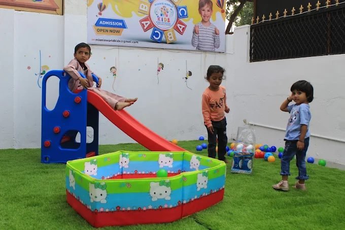 Children playing at Minnie World Kids Pre-School outdoor play area in Vastral, Ahmedabad